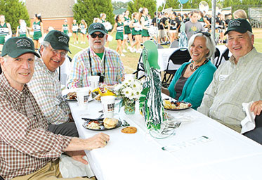 A group of men and a woman sitting at a table. Link to Life Stage Gift Planner Over Age 65 Situations.