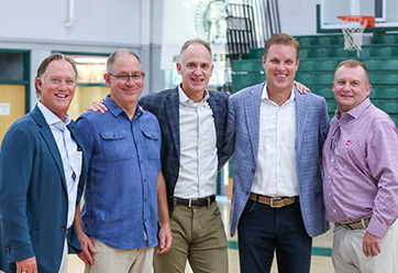 A group of men in a gymnasium, smiling. Link to Life Stage Gift Planner Ages 45-65 Situations.