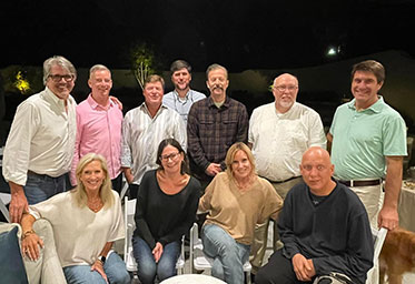 A group of people smiiling for a photo. Links to Gifts of Life Insurance