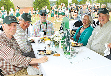 A group of men and a woman sitting at a table. Link to Life Stage Gift Planner Over Age 65 Situations.