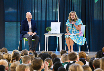 Two people on a stage speaking to a crowd. Links to Beneficiary Designations Two people on a stage speaking to a crowd. Links to Beneficiary Designations