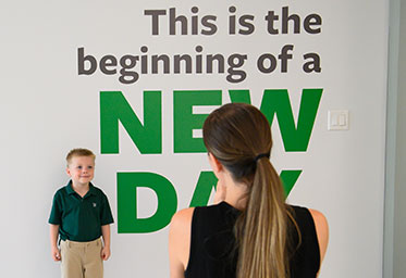 A boy having his picture taken. Links to Gifts That Protect Your Assets