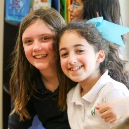 Two girls smiling
